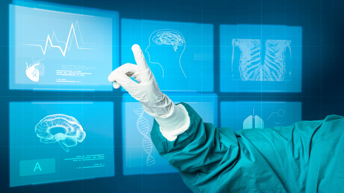 Healthcare personnel pointing at digital screen