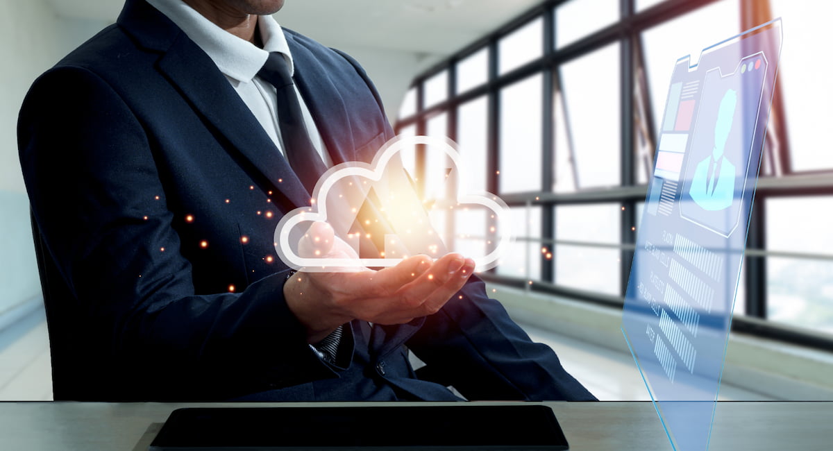 Man with hologram of screen and cloud